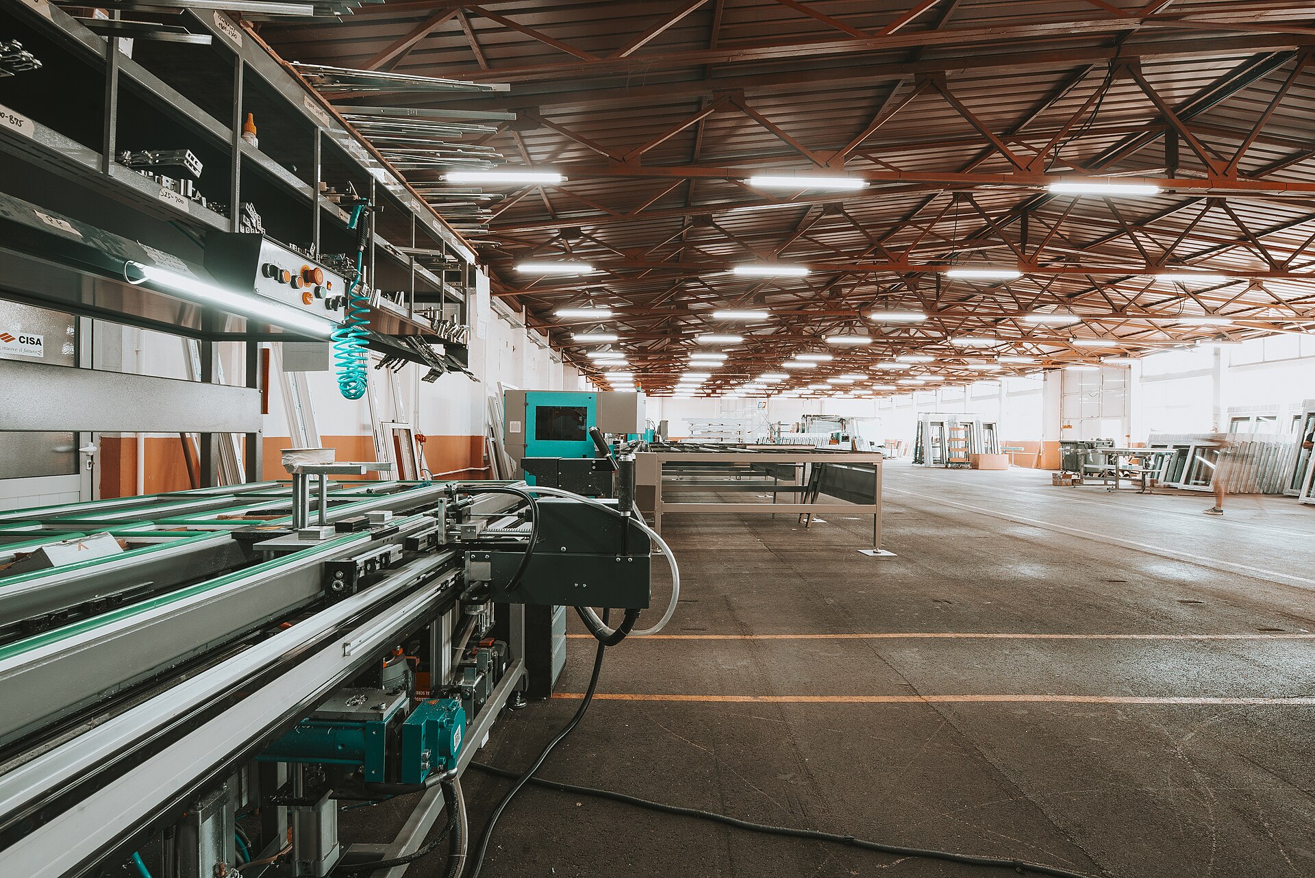 Interior of a large modern factory with an industrial production line