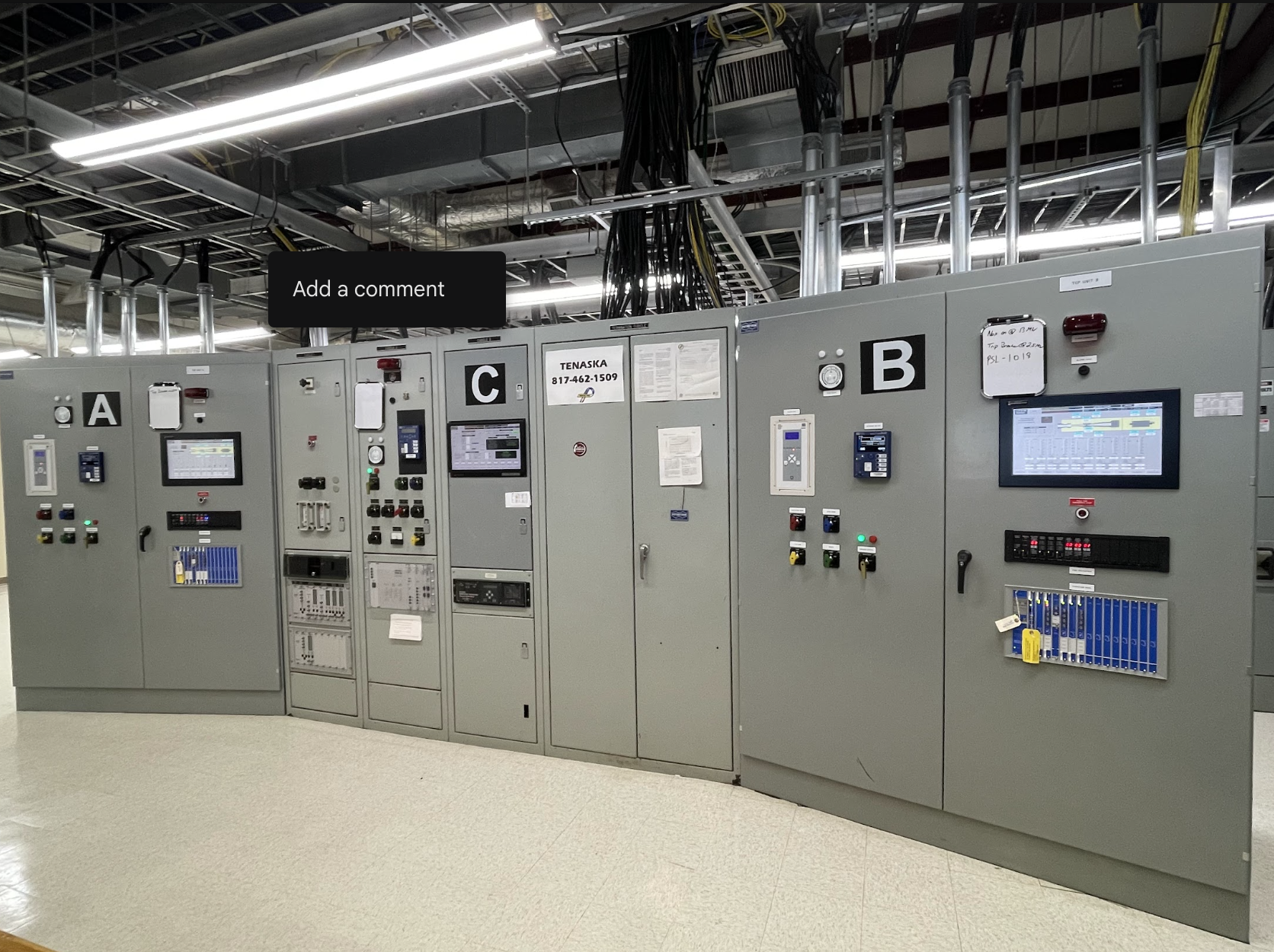 Lineup of switchgear and control panels with operator interfaces