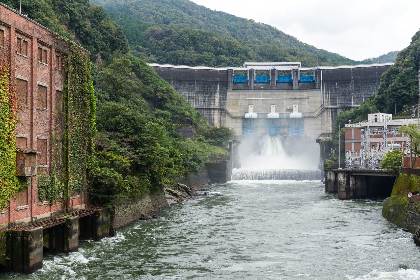 Hydroelectric dam releasing water at a hydro power plant