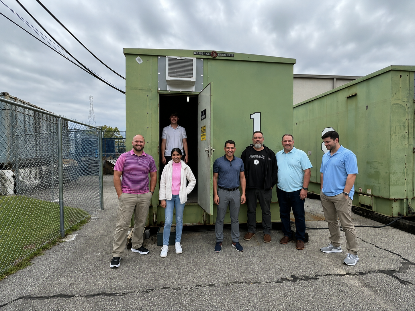 Innova Technologies team standing in front of a control building enclosure