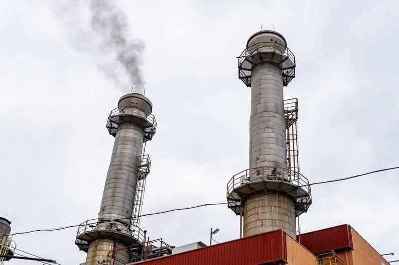 Power plant with steam stacks and piping