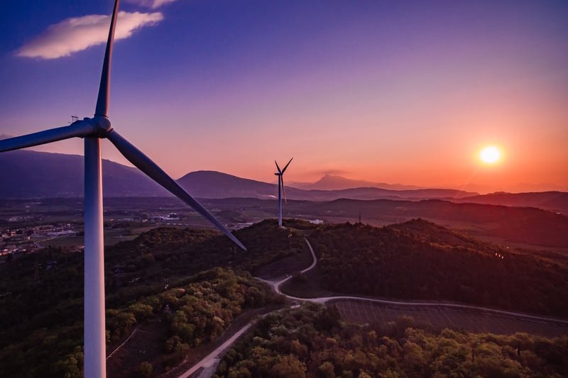 Wind turbines at sunset generating renewable power
